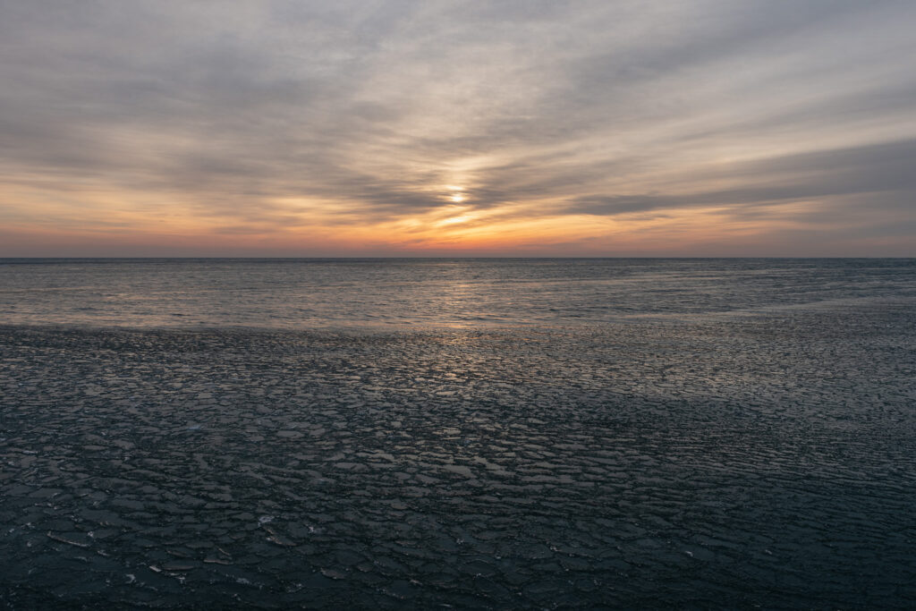 Ice chunks float in Lake Michigan at sunrise - Chicago lakefront photography by Michael Courier